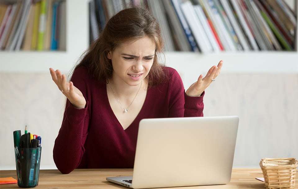 Frustrated Woman on Laptop