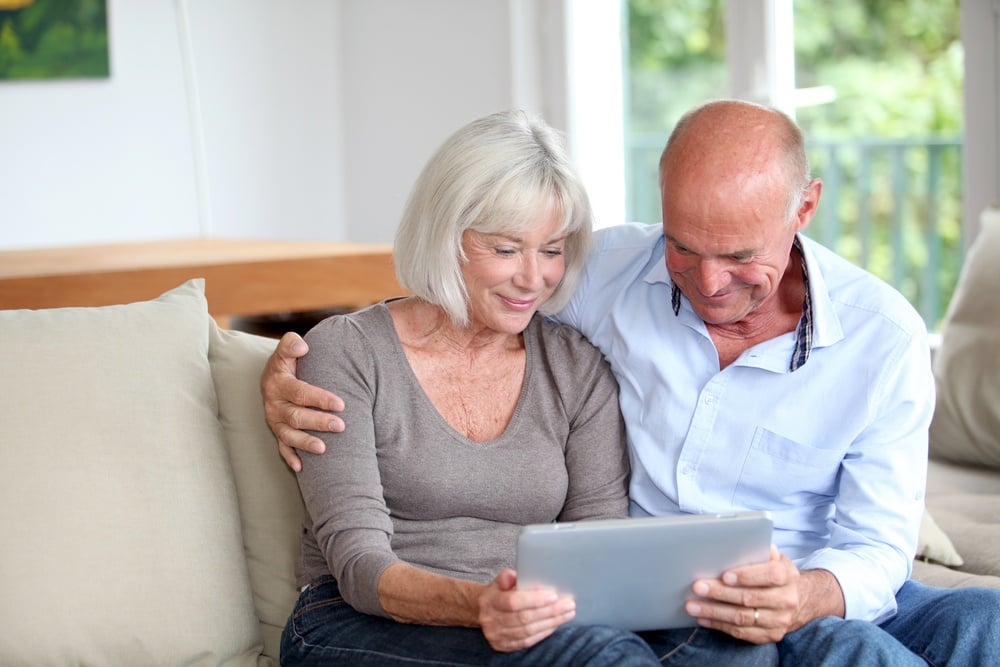 Senior couple using tablet